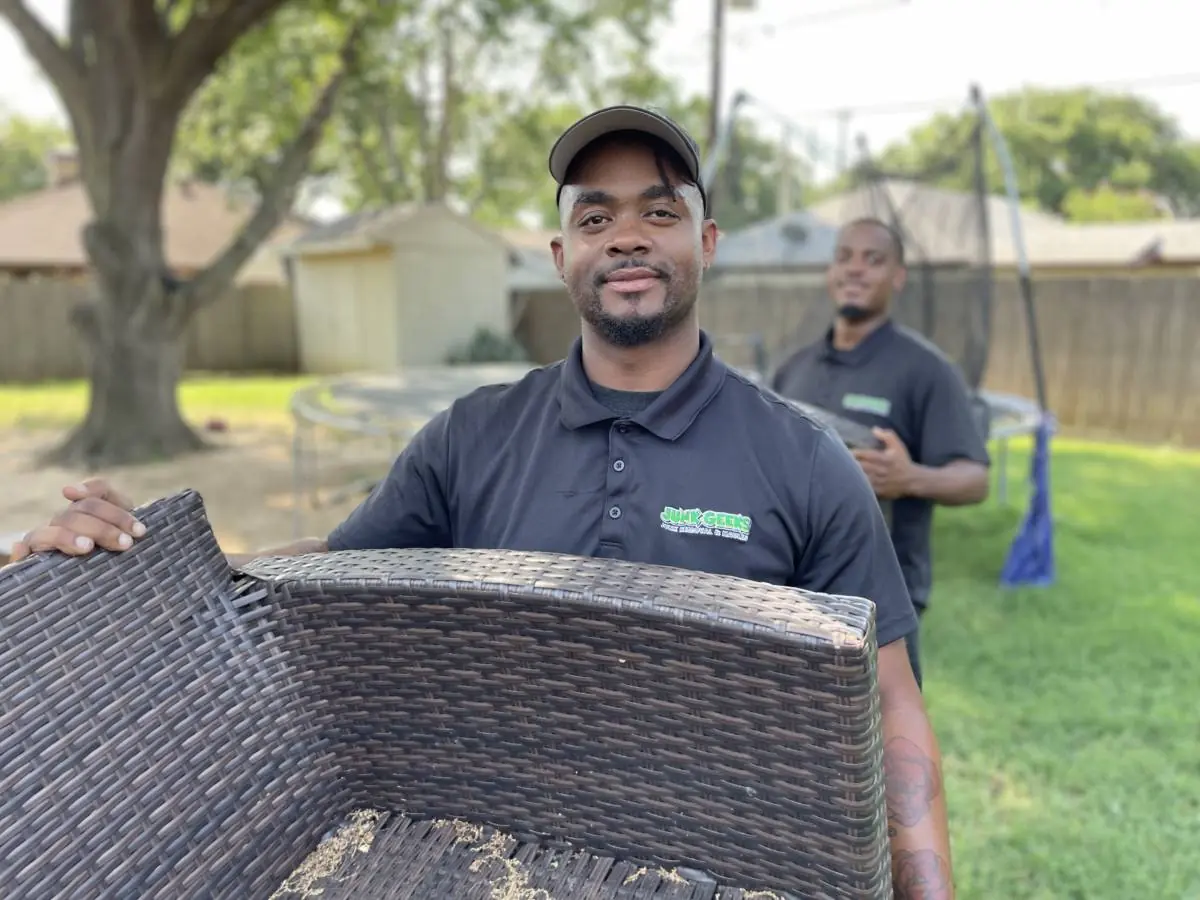 junk geeks crew hauling old yard furniture